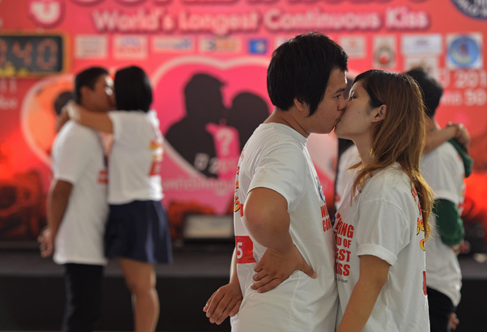 Pattaya, Thailand: Couples kiss during a competition